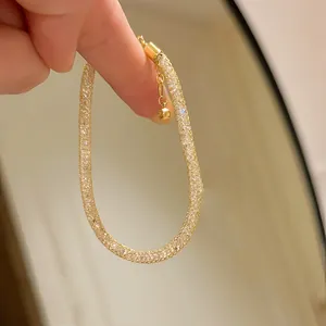 Detail showing the sparkling texture of this French-style gold zircon mesh bracelet