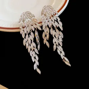 Elegant silver-toned leaf tassel drop earrings with sparkling zircon for a luxury style.