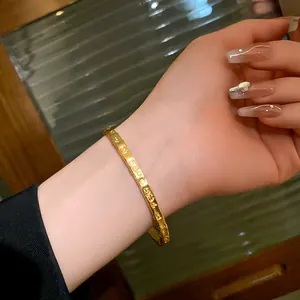 Close-up of gold-plated titanium steel bamboo-joint bracelet on wrist