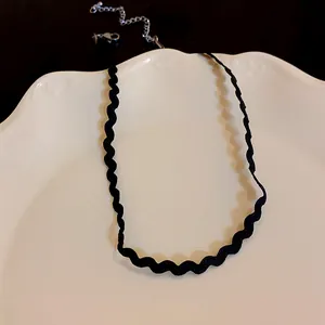 Elegant black wavy lace choker necklace featuring an adjustable silver extension chain