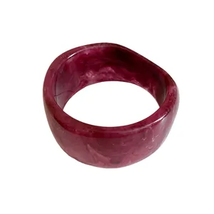 Elegant wide resin bangle with red marble texture and minimalist geometric design