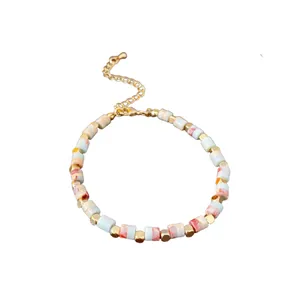 Minimalist colorful cylindrical bead bracelet with gold faceted spacer beads and extender