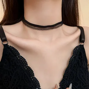Macro detail view of an elegant black lace mesh choker necklace worn on model's neck