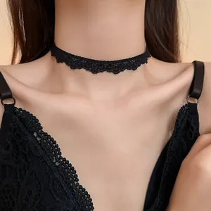 Close-up of elegant black lace choker necklace with mesh design on neck