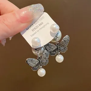 Exquisite vintage silver needle butterfly pearl earrings with detailed wing textures