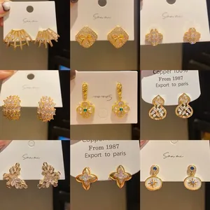 Detailed grid view of assorted vintage-style gold earrings with brilliant zircon accents.