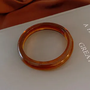 Transparent amber resin bangle bracelet in elegant retro style