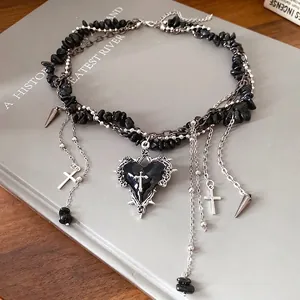 Gothic black stone beaded choker necklace featuring a central heart and cross charms
