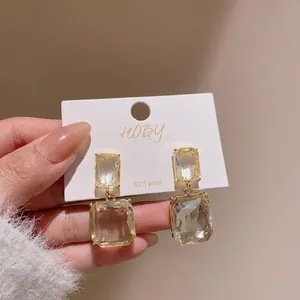 Elegant 925 silver needle earrings featuring transparent square crystal dangles