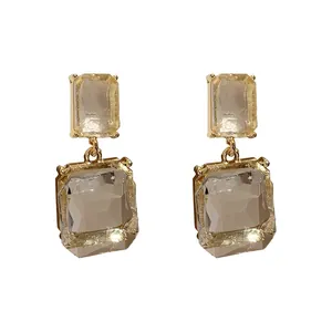 Elegant geometric drop earrings with transparent square crystals and gold finish
