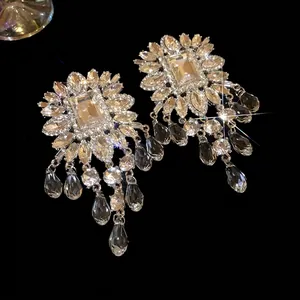 Sparkling oversized crystal tassel earrings with square center and silver needle back
