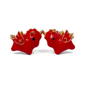 Red enamel winged horse stud earrings with gold trim and sterling silver needles