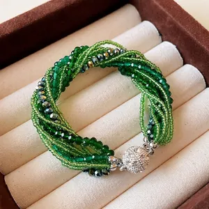 Elegant multilayer green crystal and seed bead bracelet with rhinestone magnetic clasp