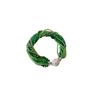 Elegant multilayer green crystal seed bead bracelet featuring a sparkling rhinestone ball clasp