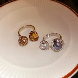 Elegant vintage style open rings with faceted amber stone and grey pearl decoration