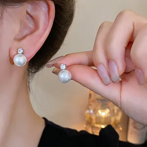Elegant silver needle zircon pearl stud earrings for women, retro luxury style accessory.