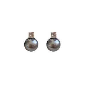 Elegant silver stud earrings featuring sparkling cubic zirconia and dark grey pearls.