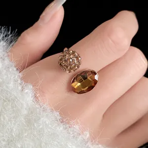 Detailed macro view of a vintage style open ring with a sparkling brown oval crystal