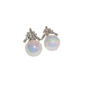 Elegant French style mermaid pearl stud earrings featuring sparkling rhinestones on white