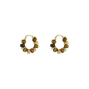 Elegant gold-plated hoop earrings featuring natural tiger eye stone beads in vintage style.
