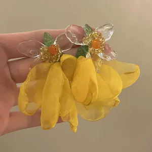 Elegant handmade yellow chiffon flower earrings with clear petals and hypoallergenic silver needle.