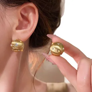 Elegant 18K gold plated brushed sphere stud earrings with star-set cubic zirconia