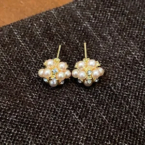 Detailed view of elegant pearl flower cluster stud earrings with zircon accents