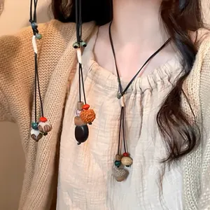 Sautoir en perles de bois style Zen rétro avec design ethnique bohème pour femme