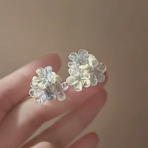 Handmade translucent resin flower stud earrings with elegant gold foil details for women