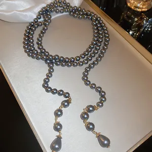 Elegant dark gray multi-layer pearl necklace with vintage gold accents and waterdrop pendants