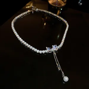Sparkling silver zircon bowknot clavicle necklace featuring a delicate hanging pearl pendant