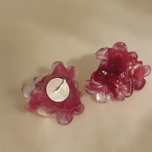 Detail view of pink resin flower stud earrings with S925 silver needles for women