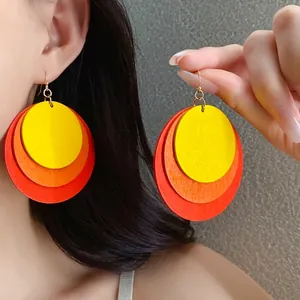 Vibrant bohemian multi-layer round wooden drop earrings in sunset gradient design