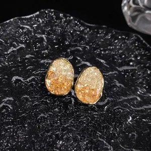 Elegant oval crystal geometric stud earrings with amber and gold tones for daily wear