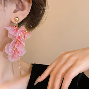 Detailed view of pink mesh flower drop earrings featuring elegant gold bar accents