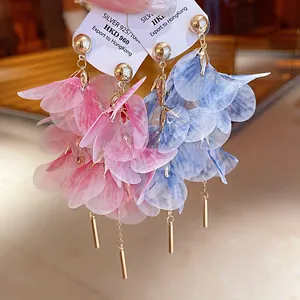 Close-up of pink and blue layered gauze flower earrings with 925 silver needle tags.