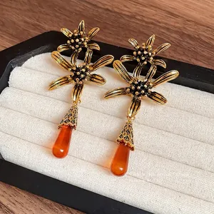 Elegant vintage resin flower waterdrop tassel earrings with light luxury golden finish