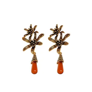 Vintage gold flower earrings with elegant orange resin water drop pendants for women, retro.