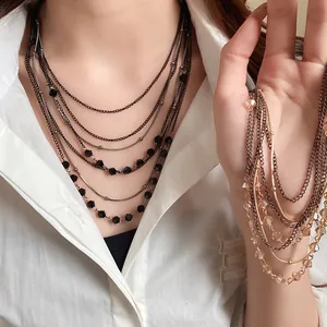 Close-up of vintage multi-layer necklace with glass beads on a model
