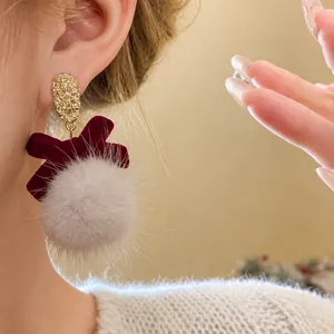 Elegant red velvet bow earrings with grey faux fur pom pom and gold hammered top design