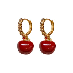 Elegant 18K gold plated hoop earrings featuring sparkling CZ stones and red apple charms