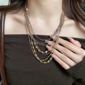 Detailed close-up shot of a vintage multi-layered necklace featuring amber glass beads
