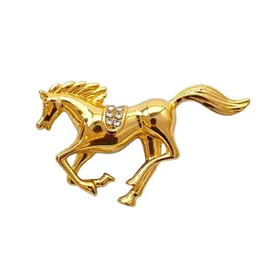 Elegant gold-toned running horse brooch with sparkling rhinestones fashion accessory.