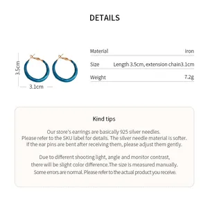 Detail view of teal hoop earrings with 3.5cm length and iron material specs.