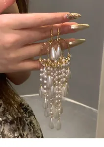 Elegant long pearl tassel earrings with gold-tone zircon accents in a vintage French court style
