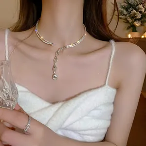 Close-up detail of elegant zircon water drop choker necklace worn by a female model