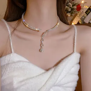 Detailed view of an elegant zircon water drop choker necklace on a model's neck.