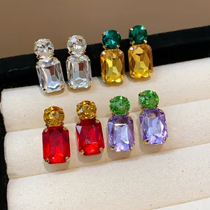 Close-up of sparkling square crystal earrings in multiple vibrant colors for women