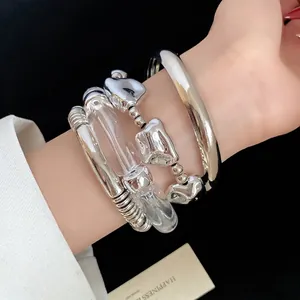 Retro 4-piece set of irregular metallic and clear acrylic geometric bangles for women