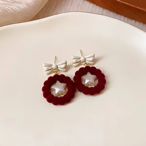 Elegant red flocked bow earrings with star motif for autumn and winter fashion accessory